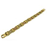 A 9CT TRI-COLOURED GOLD BRACELET The bracelet of open work design with large standard clasp
