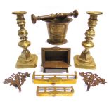 ASSORTED BRASSWARE comprising a pestle and mortar; a pair of candlesticks, 22.5cm high; a Cosmos