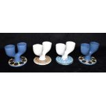 FOUR TROIKA POTTERY DOUBLE EGG CUPS: a pair decorated with circles on a blue ground, and two further