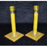 A PAIR OF CHROME MOUNTED BAKELITE CANDLESTICKS on square bases, 20cm high Condition Report : good