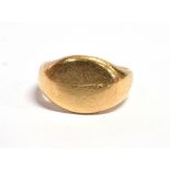 AN 18CT GOLD PLAIN SIGNET RING the plain oval front with inscription for 1919 to reverse, stamped