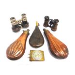 THREE POWDER FLASKS comprising two copper and one embossed leather; a Great War German belt