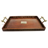 A CHINESE HARDWOOD TRAY with pierced and carved gallery, white metal bamboo form handles and