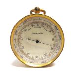 A GILT BRASS POCKET BAROMETER incorporating to the reverse a thermometer and a compass, 5cm diameter