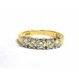 AN 18CT GOLD, DIAMOND FIVE STONE RING The five brilliant cut diamonds each measuring 3.5mm in