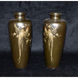 A PAIR OF JAPANESE BRONZE BALUSTER SHAPED VASES with silver and gold inlaid decoration of long