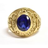 A MARKED 375 SAPPHIRE BOMBE RING The oval sapphire measuring 0.9cm x 0.6cm in an ornate setting