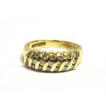 A DIAMOND SET DRESS RING The ring with tapered band, shank with worn markings, ring size L, weight