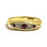 A MARKED 18CT RUBY AND DIAMOND BOAT RING The yellow gold shank with stamped 18ct mark, ring size