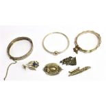 A COLLECTION OF VICTORIAN AND LATER SILVER AND WHITE METAL JEWELLERY comprising four brooches and