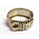 A VINTAGE SILVER BELT AND BUCKLE BANGLE the bangle 2.6cm wide, diameter 5.3cm, faded Birmingham