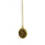 A 9CT GOLD OVAL 'LOCKET' PENDANT AND TRACE LINK CHAIN The oval 'locket' with engraved patterned