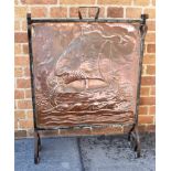 A NEWLYN SCHOOL ARTS & CRAFTS WROUGHT IRON AND COPPER FIRE SCREEN with embossed decoration of a