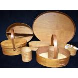 A GROUP OF FRUITWOOD SHAKER STYLE SWALLOWTAIL BOXES AND BASKETS ETC. comprising an oval basket