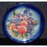A MOORCROFT POTTERY 'FINCHES AND FRUIT' PATTERN PLATE painted monogram, impressed marks and date
