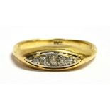 A DIAMOND SET BOAT RING The band of yellow metal with a punched mark, faded possibly 15ct or 18ct,