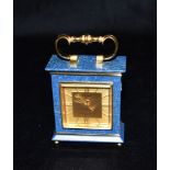 A SMALL MAPPIN & WEBB 'LUXOR' 8-DAY ALARM CLOCK in gilt brass and faux lapis lazuli case, 10.5cm