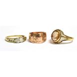 THREE MARKED 9CT GOLD RINGS comprising a cameo ring Size R, a clear paste set ring Size R ½ , a rose