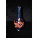 A MOORCROFT POTTERY 'POMEGRANATE' PATTERN VASE 31.5cm high, of ovioid form wht slender neck,