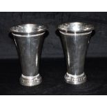 A MATCHED PAIR OF SILVER VASES The vases of plain form with patterned boarder to the top and