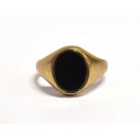 A 9CT GOLD BLACK HARDSTONE SIGNET RING Birmingham hallmark, size K ½ weight 3.4grams