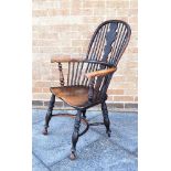 A YEW WOOD, ASH AND ELM WINDSOR CHAIR with shaped splat, on crinoline stretcher base