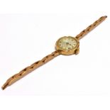 A 9CT GOLD ROSE GOLD VINTAGE WRISTWATCH The inside case marked LAGAROS Swiss made 15 jewels, strap