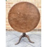 A MAHOGANY TILT TOP TRIPOD TABLE the circular top 85cm diameter