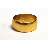 A 9CT GOLD WIDE BAND RING the shank hallmarked, possibly London, date letter S, maker J.Ld, band