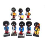 EIGHT ROBERTSON'S GOLLY BANDSMEN each approximately 7.5cm high. Condition Report : Generally good