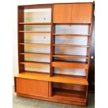 A G-PLAN TEAK WALL UNIT the upper section with shelves, cupboard and pair of drawers, the base