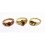 THREE VINTAGE 9CT GOLD RINGS Red stone set dress rings, ring sizes Q ½, T ½ and S, all with faded