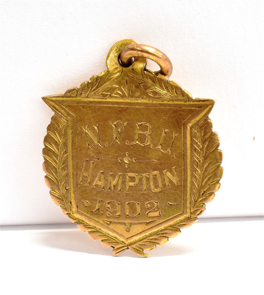 A 9CT GOLD FIREMAN CHALLENGE MEDAL adapted for pendant/fob, engraved for 1902, Birmingham