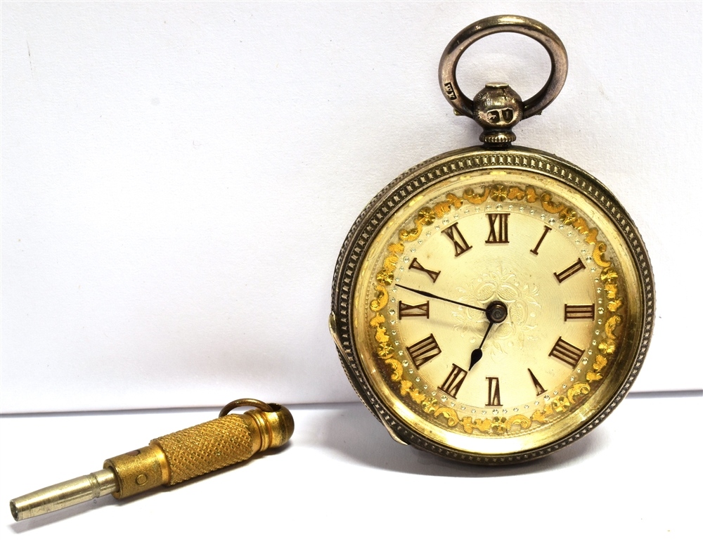 AN ORNATE SILVER CASED POCKET WATCH with key, case measurement 3.7cm, weight with attached key