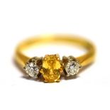 A CITRINE AND DIAMOND DRESS RING The ring set with a single faceted oval citrine (0.6 x 0.4cm)