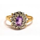 A PURPLE ALMANDINE AND WHITE SAPPHIRE CLUSTER RING cluster measurement 1 x 1cm, shank hallmarked,