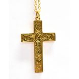 A MARKED 9CT PATTERNED CROSS with attached unmarked chain, the cross pendant with engraved