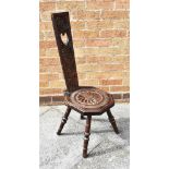 A CARVED OAK WELSH SPINNING CHAIR