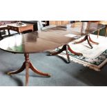 A REGENCY STYLE TRIPLE PILLAR MAHOGANY DINING TABLE with two additional leaves, 344cm long fully