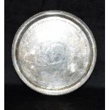A GEORGE IV FOOTED SILVER TRAY the small tray on three feet with beaded border, with central bird