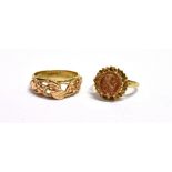 TWO VINTAGE RINGS A 9ct gold medallion set ring, size N ½ weight 3g, a yellow metal open work band