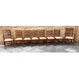 A SET OF EIGHT EDWARDIAN INLAID MAHOGANY LADDERBACK CHAIRS with crossbanded decoration, including