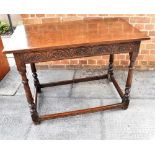 AN OAK SIDE TABLE with carved frieze, on turned supports, 97cm x 56cm, 73cm high Condition