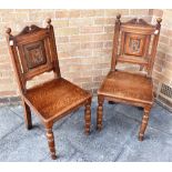 A PAIR OF OAK HALL CHAIRS the backs carved with monograms 'AP' and 'MP' within shield Condition