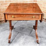 A VICTORIAN SOFA TABLE with crossbanded and inlaid decoration, single frieze drawer on sabre legs,