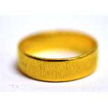 A 22CT GOLD BAND RING The band with textured pattern band width 0.5cm, size P ½ weight 5.6g