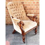 A VICTORIAN MAHOGANY FRAMED BUTTON UPHOLSTERED ARMCHAIR on turned supports