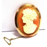 A STAMPED 9CT MOUNTED CAMEO BROOCH with safety chain, measurement 4 x 3.3cm, safety catch barrel