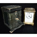 A BRASS CASED CARRIAGE CLOCK the unsigned enamel dial with Roman numerals, 12cm high with handle