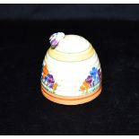 A CLARICE CLIFF 'CROCUS' PATTERN HONEY POT the cover with moulded bee knop handle, printed factory